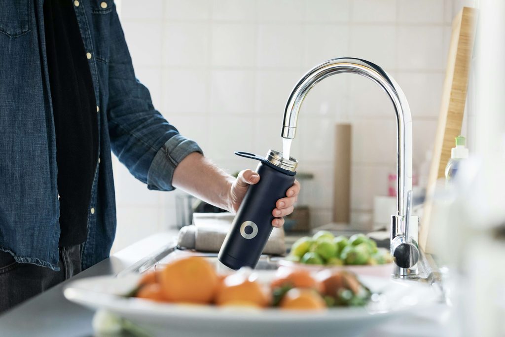 Filling up a water bottle from a kitchen sink faucet