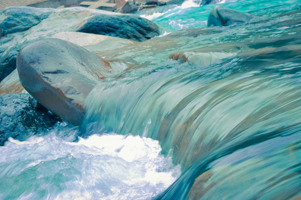 River water flowing through rocks
